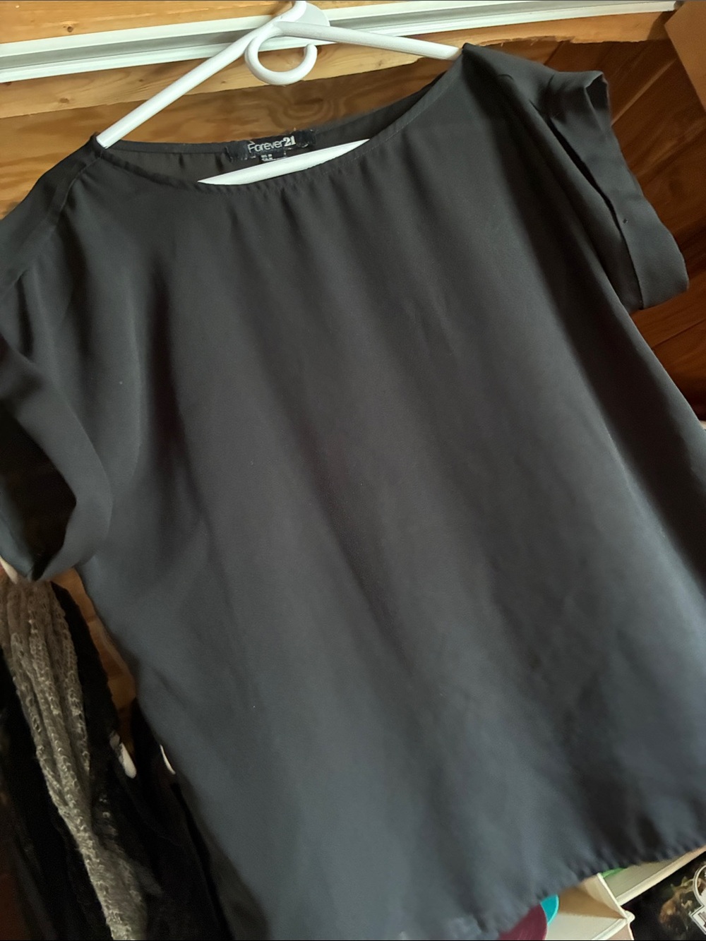 Gently used flowy black house short capped sleeves size M.
